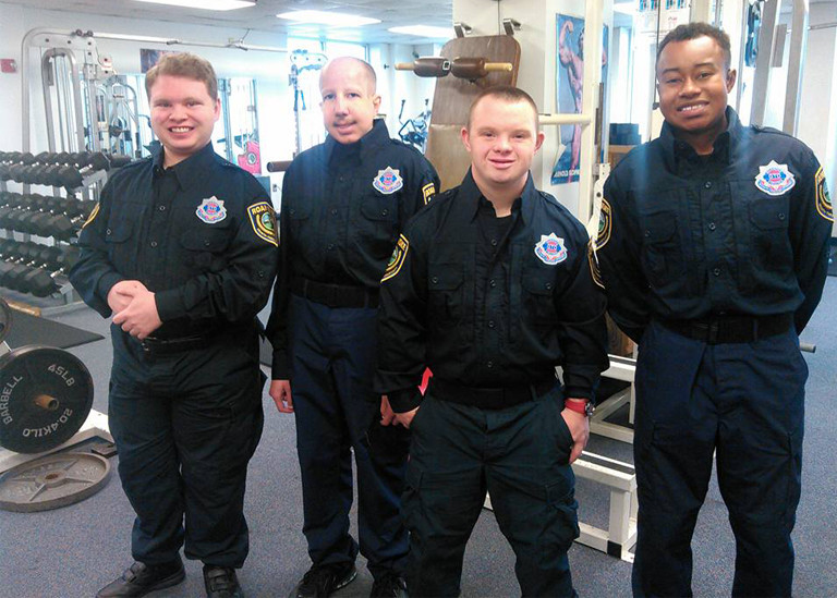 Photo of 4 GTO cadets in weight room.